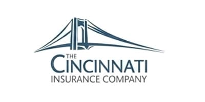 Logo for The Cincinnati Insurance Company featuring a stylized suspension bridge in gray and blue tones above the company name in serif typography. The bridge design represents strength and reliability, reflecting the insurance industry's core values. The minimalist, professional design conveys trust and stability.